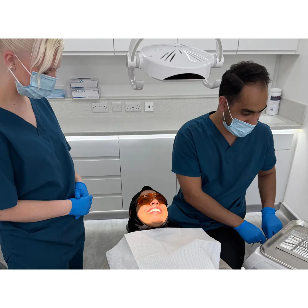Dental hygienist providing preventive treatment